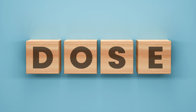Wooden Blocks Spell DOSE on a Blue Background