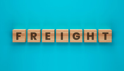 Obraz premium Freight Word Blocks: Wooden blocks spelling out the word FREIGHT are neatly arranged on a vibrant teal background, symbolizing logistics and transportation.