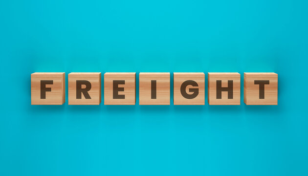 Freight Word Blocks: Wooden blocks spelling out the word FREIGHT are neatly arranged on a vibrant teal background, symbolizing logistics and transportation.