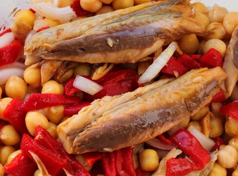Spanish tapas - salad of Atlantic Mackerel fillets in escabeche, chickpeas, roasted red peppers and sweet onions. Dressed with olive oil and white wine vinegar.
