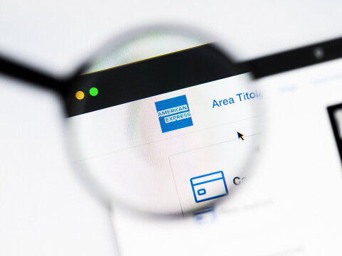 Milan, Italy 2026, 20 Apr Closeup of American Express website on a laptop screen. American Express logo under a magnifying glass.