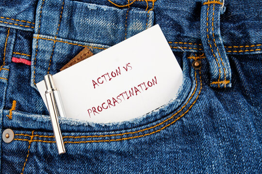 A powerful reminder rests in the pocket of blue denim, urging a choice between taking action and delaying tasks. This moment captures the essence of lifes daily decisions