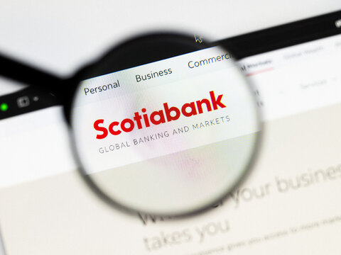 Milan, Italy 2026, 20 Apr Closeup of Bank of Nova Scotia website on a laptop screen. Bank of Nova Scotia logo under a magnifying glass.