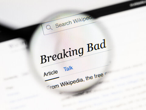 Milan, Italy 2026, 20 Apr Closeup of Breaking Bad Wikipedia page on a laptop screen. Breaking Bad name under a magnifying glass.