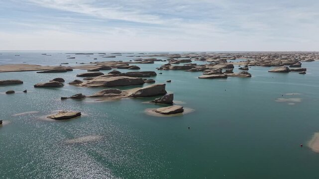 Remote Desert Lake and Yardang Formations Seen From Above