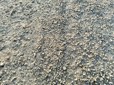 Close up of a rough gravel and dirt surface