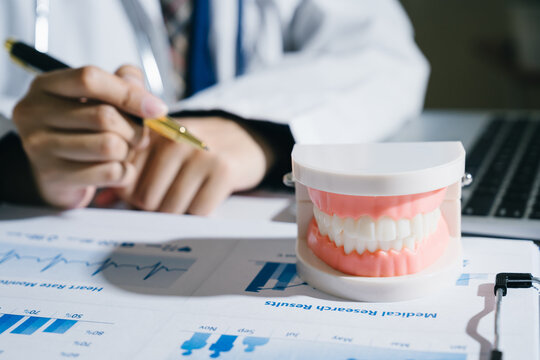 Dental model teeth medical research healthcare doctor clinic dental care health medical report stethoscope pen patient examination oral hygiene dentist teeth model medical chart health data dental