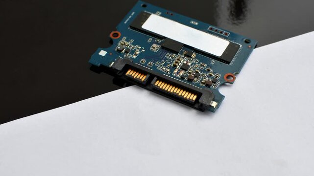 Close-up of an SSD circuit board, showcasing the complexity and precision of modern storage technology.