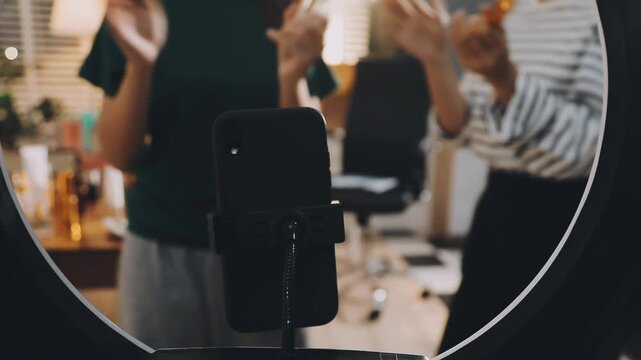 Diverse Beauty Bloggers Live Streaming Makeup Product Review on Social Media, Young Women Recording Video for Vlogging Channel with Ring Light, Friends Selling Cosmetic Products Online from Home