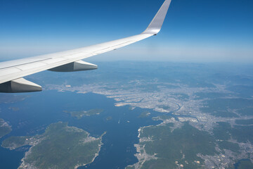 Obraz premium Hiroshima Cityscape and Hiroshima Bay Viewed from Airplane Window, Hiroshima, Japan