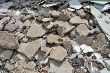A high angle view of shattered concrete pieces ceramic tiles and drywall fragments from building demolition. © nahhan