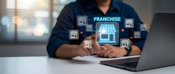Fototapeta premium Businessman on a laptop analyzing franchise business opportunities in a virtual interface
