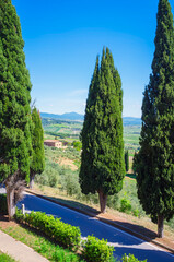 Naklejka premium Panoramic view of the hills and countryside surrounding the village of Pienza (Tuscany village, Italy) seen from its medieval fortified walls, during early summertime.