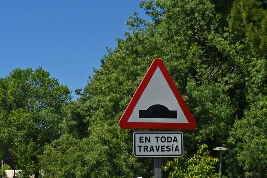 A triangular warning road sign indicating uneven or artificial uneven road surface, located on the M-607 Autov&iacute;a de Colmenar Viejo, in the Madrid region, Spain. June 05, 2026