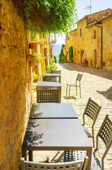 Naklejka premium View of and old alley in Pienza, medieval village of Tuscany (Province of Siena, Italy)
