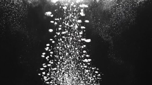 Black and White Macro Shot of Boiling Water Bubbles Rising to Surface with Steam
