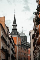 Naklejka premium Architecture of the city center of Madrid, Spain. Alley and narrow roads with Spanish balconies and design.