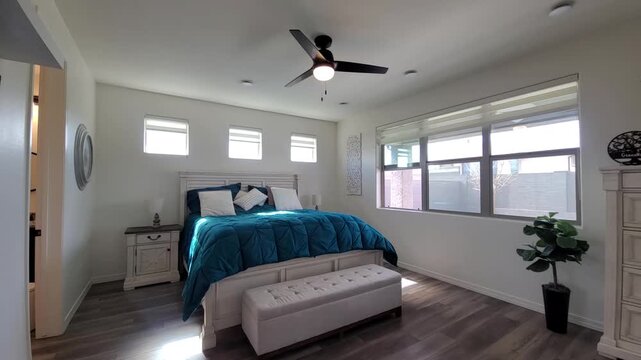 Bright Teal Quilt Bedroom With Natural Light
