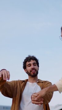 Happy carefree gay guys dancing having fun and hugging in city together , enjoying
recreation time.
Romantic Lgbt couple in great mood playing around and dancing,
feeling love and freedom. Slow motio