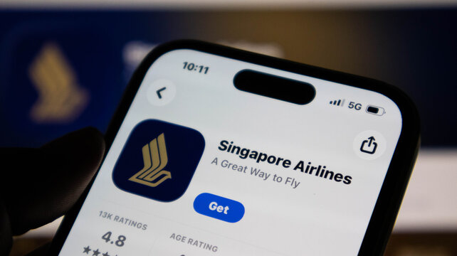Closeup of a smartphone screen displaying the singapore airlines mobile app store page with the download button visible