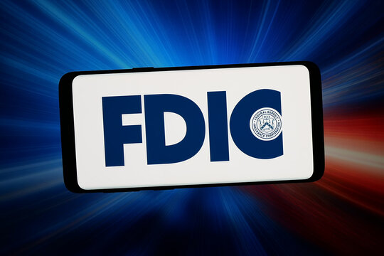 Stuttgart, Germany - 06-02-2026: In this photo illustration, the logo of Federal Deposit Insurance Corporation (FDIC) is displayed on a smartphone in front of abstract background on computer screen.