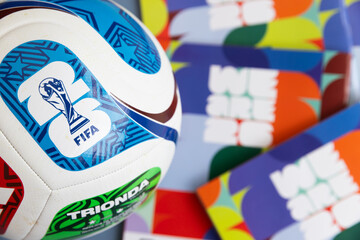 Naklejka premium LONDON, UK - JUNE 2026: Official FIFA World Cup 2026 match ball displayed with tournament branding and sticker collection album