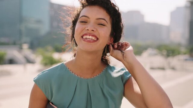 Face, funny and business woman in city, real estate agent or professional with career growth. Smile, person or realtor at town with confidence, about us or worker with wind in hair in Portugal