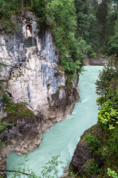 Water rushes over rocks at Lechfall in Bad Faulenbach, F&uuml;ssen during daytime in Bayern, Germany.