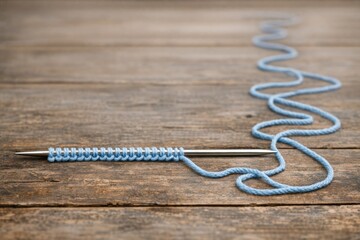 Obraz premium A single crochet hook placed on a wooden table