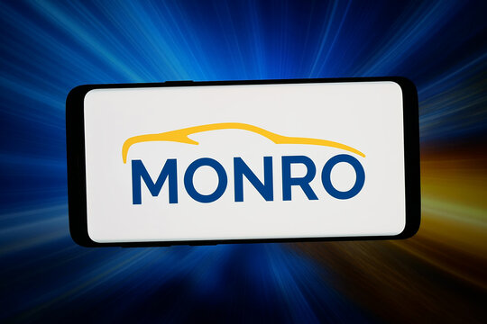 Stuttgart, Germany - 06-02-2026: In this photo illustration, the logo of US automotive services company Monro Inc. is displayed on a smartphone in front of abstract background on computer screen.