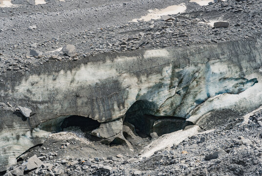Melting ice cave in Mer de Glace glacier illustrating climate change