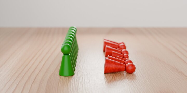 3d pawn figurines in green standing tall, with red pawns knocked over, societal issues, disagreement, winners and losers