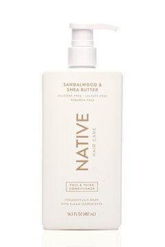 IRVINE, CALIFORNIA - 05 JUNE 2026: A pump bottle of Native Hair Care Sandalwood and Shea Butter Conditioner.