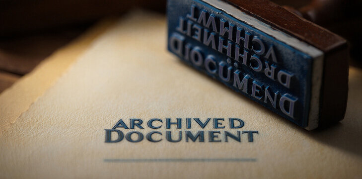Archived document rubber stamp marking on paper with archived document official business bureaucracy authentication archiving management approval validation formality organized