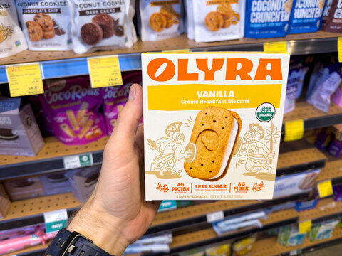 Olyra Vanilla Ancient Grain Breakfast Biscuits Held In Grocery Aisle