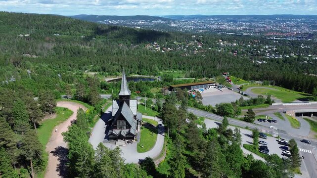Wooden church in Oslo, Norway.  Aerial drone view of Holmenkollen chapel, a tourist destination registered in Norway's cultural heritage database.