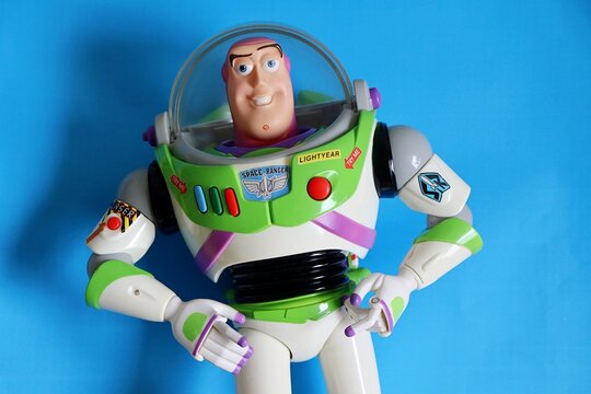 Salvador, Brazil - June 6, 2026: Buzz Lightyear toy on a blue background. Toy Story movie.