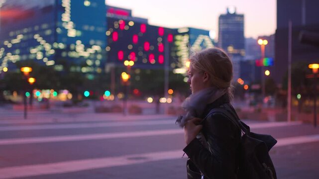 Thinking, university student and woman in city at night for commute, study abroad and inspiration. Evening reflection, exchange programme and scholar with smile for education, travel or bokeh in town