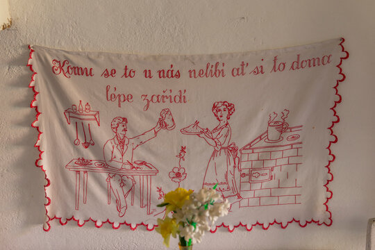 Czech traditional kitchen embroidery featuring domestic proverb