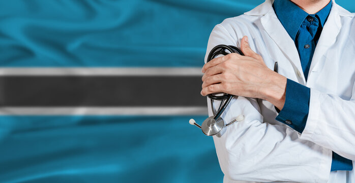 Doctor with stethoscope on Botswana flag. Doctor holding stethoscope on Botswana flag