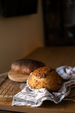Homemade sourdough loaf with Lievito Madre on cooling rack