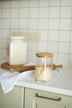 Homemade Lievito Madre sourdough starter jar on kitchen counter