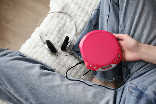 Y2K portable CD player and headphones in casual home scene