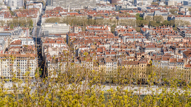 Panoramic view of Lyon rooftops and dense city blocks