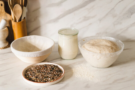 Homemade sourdough preparation with seeds and tools