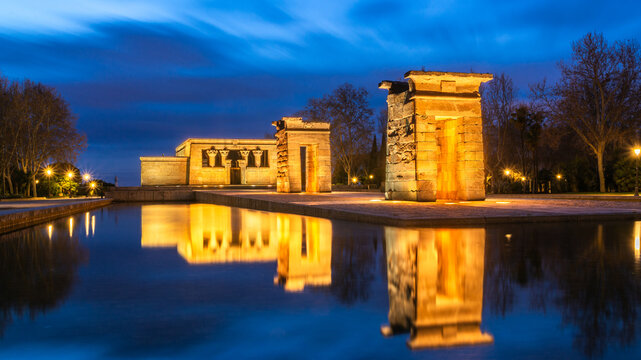 Temple of Debod at sunset reflecting in tranquil waters