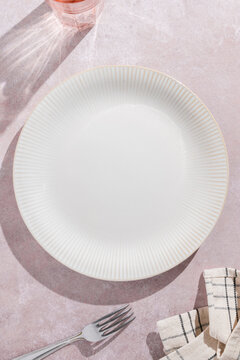 Elegant white plate on textured surface