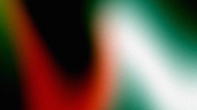 Abstract analog film grain and red light leak drifting across dark frame in gritty vintage 16mm aesthetic