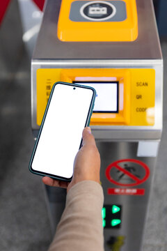 Person using smartphone for subway entry payment