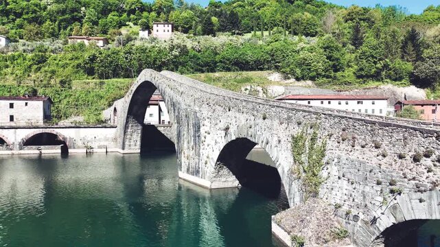 Aerial view of Devil's Bridge Ponte della Maddalena Borgo a Mozzano over Serchio River Tuscany Italy